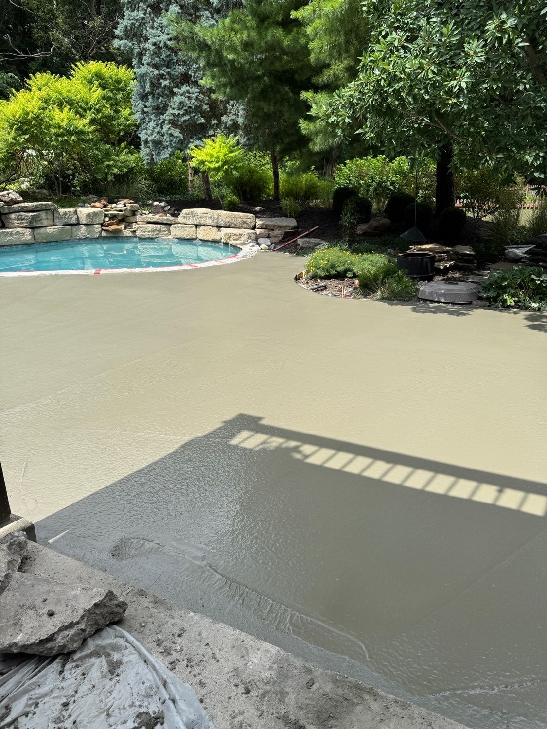 Truck with long arm reaching towards a house, likely for moving. Construction worker visible. Sunny day.