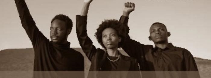 Young Black people with fists raised