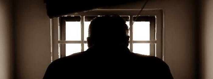 Man in a detention cell