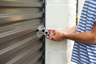 Person Locking Up The Storage Unit Door — Fairfield, CA — Cement Hill Storage