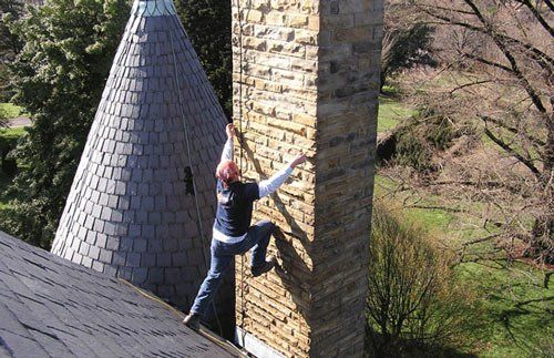 Worker Preparing to Climb Chimney - Chimney Repair in Ruther Glen, VA