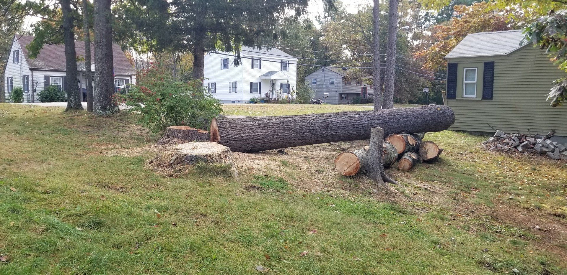 Man Mowing the Grass with a Lawn Mower — Salem, NH — Aspen Tree Service