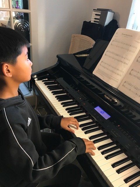 Boy playing the piano