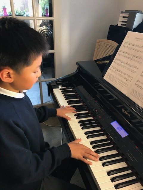 Boy playing the piano