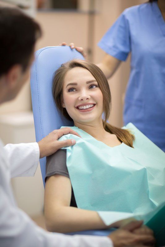 Dentist Comforting Patient — Murfreesboro, TN — Fortress Dental