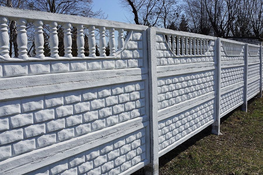 a pre-cast concrete fence