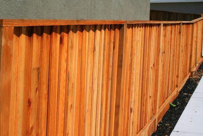 a wooden stained privacy gate