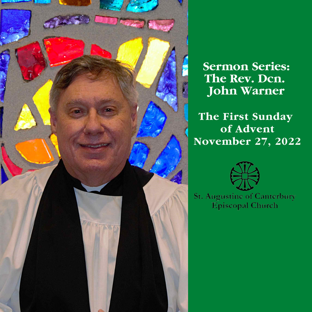 A man is standing in front of a stained glass window
