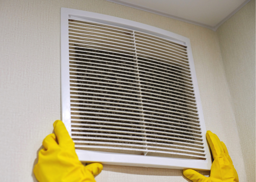 Schmitz employee removing an air vent to clean the ducts in Tucson, Arizona