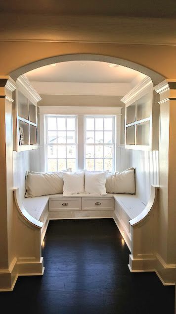 There is a window seat in the middle of the room.