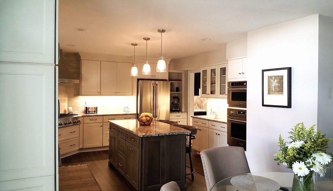 A kitchen with a large island in the middle of it