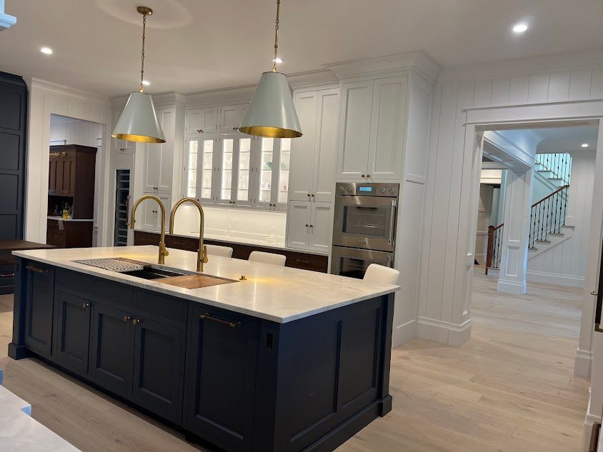 A kitchen with a large island in the middle of it.