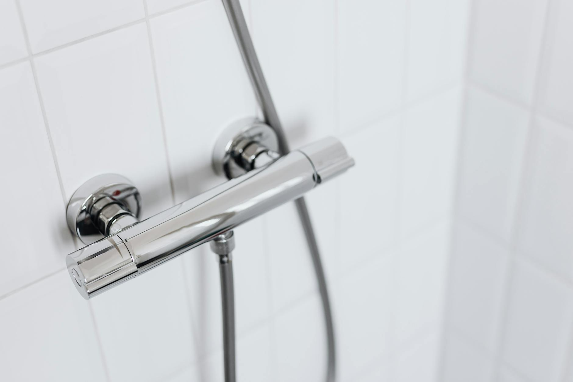 A Close Up of a Shower Head in a Bathroom — Beaumont Plumbing in Glenfield Park, NSW