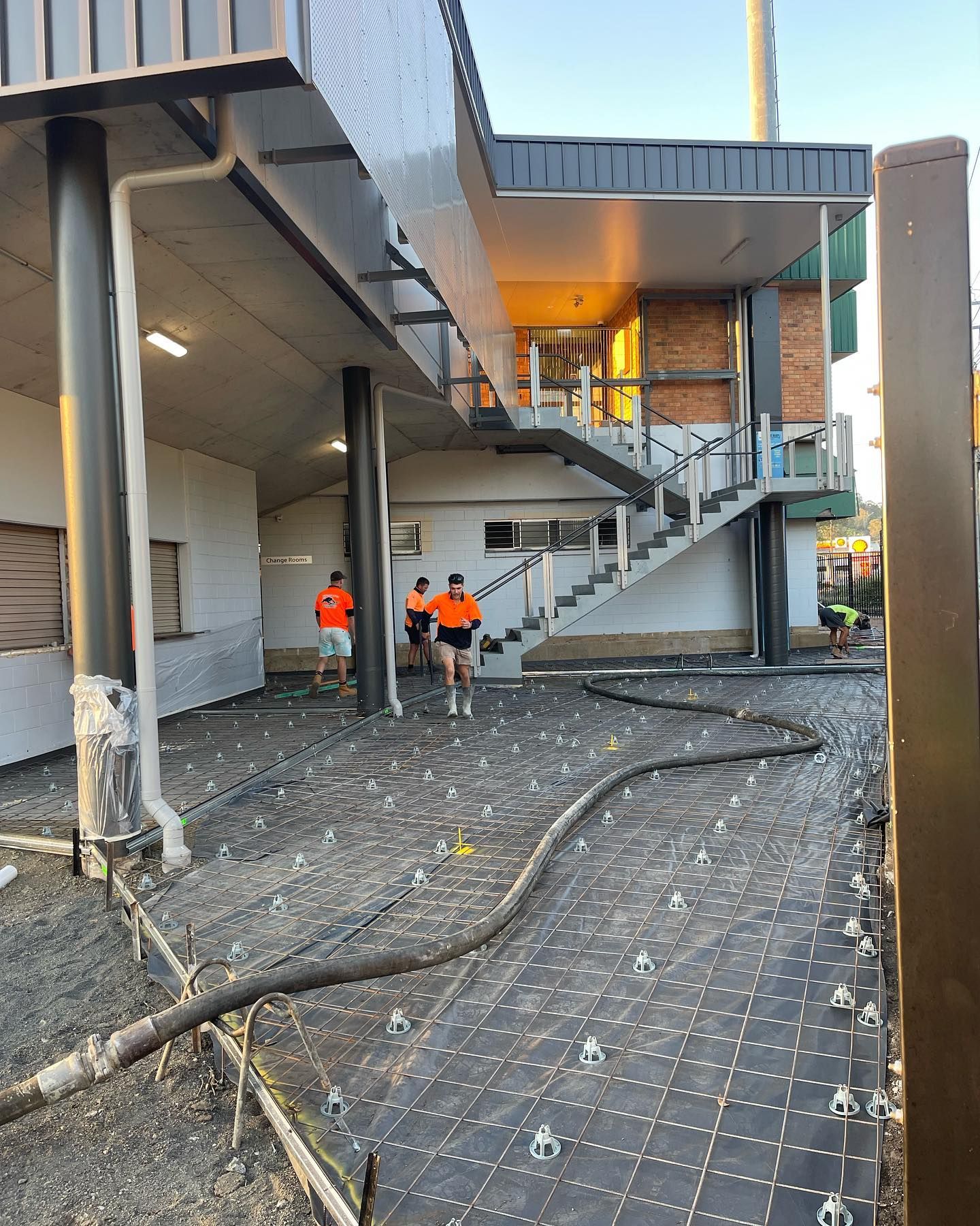 Group of Construction Workers Working Outside of a Building — Casino, NSW — Lismore Concrete Pumping