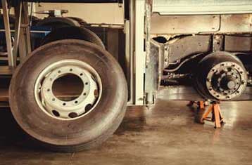 Spare wheel tire and axle bus on lifting jack - Welding Services in Greenville, SC
