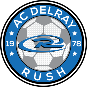 AC Delray Rush soccer logo. Blue and gray circular emblem with text and stylized
