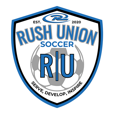 Rush Union Soccer logo: blue and white shield with
