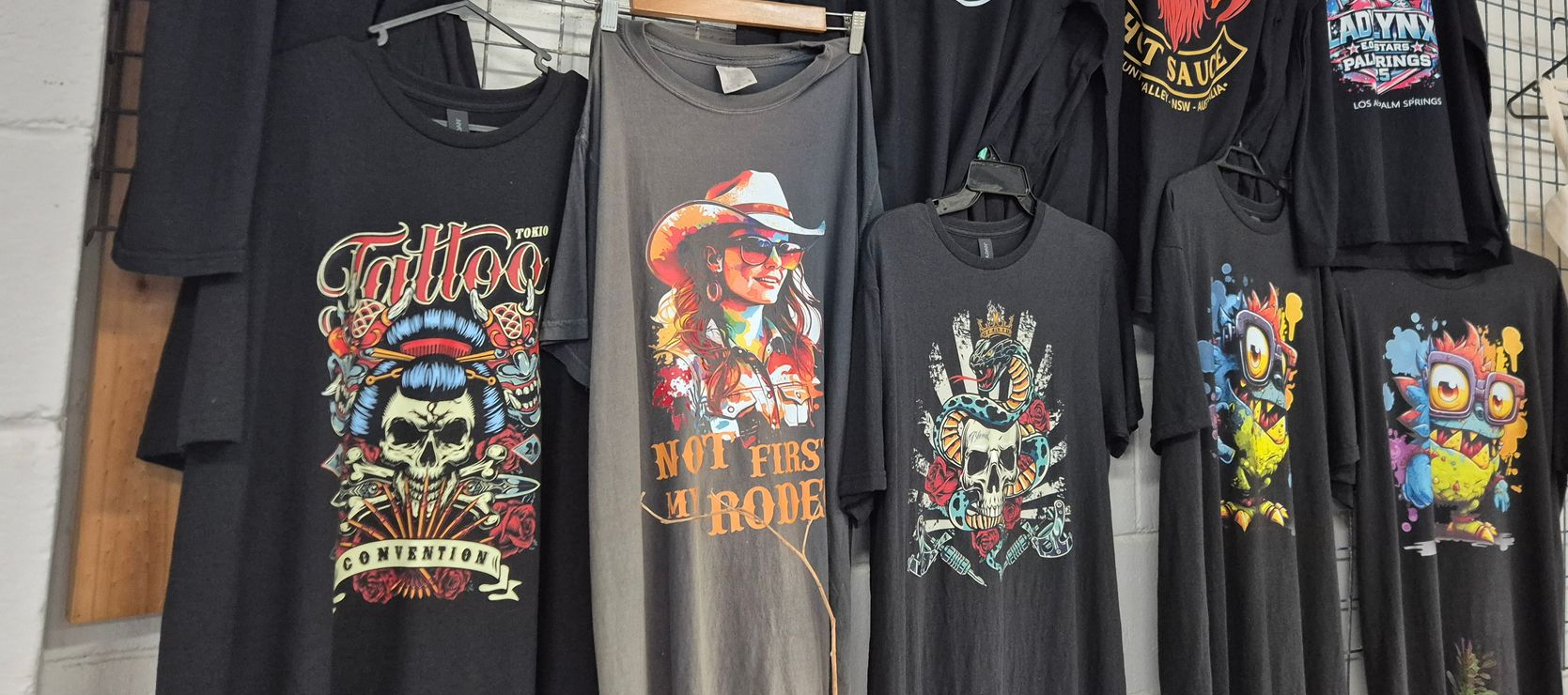 Black T-shirt With Colorful Cowboy — Al's Custom Prints in Wyong, NSW