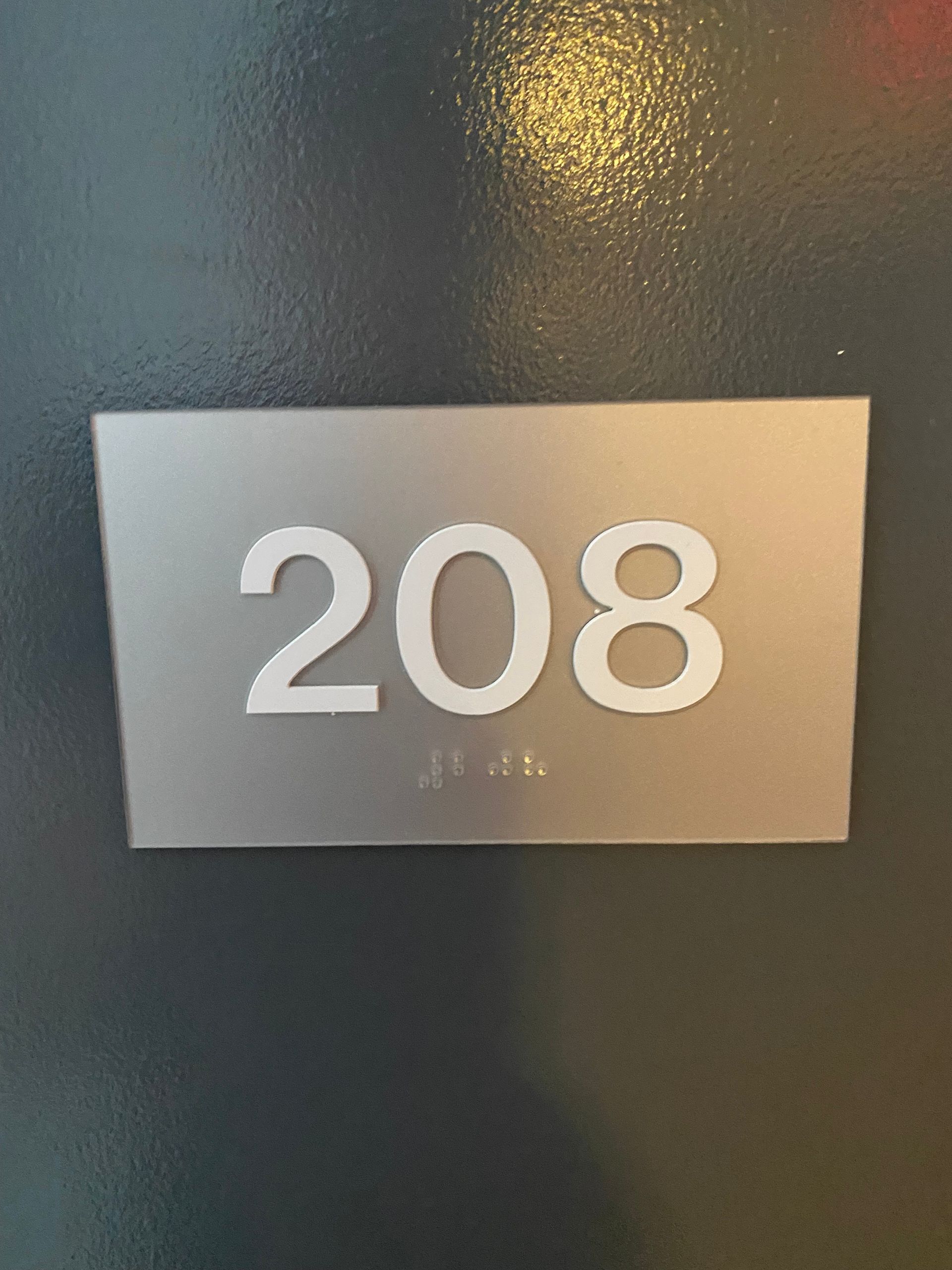 A sign with the number 208 on it