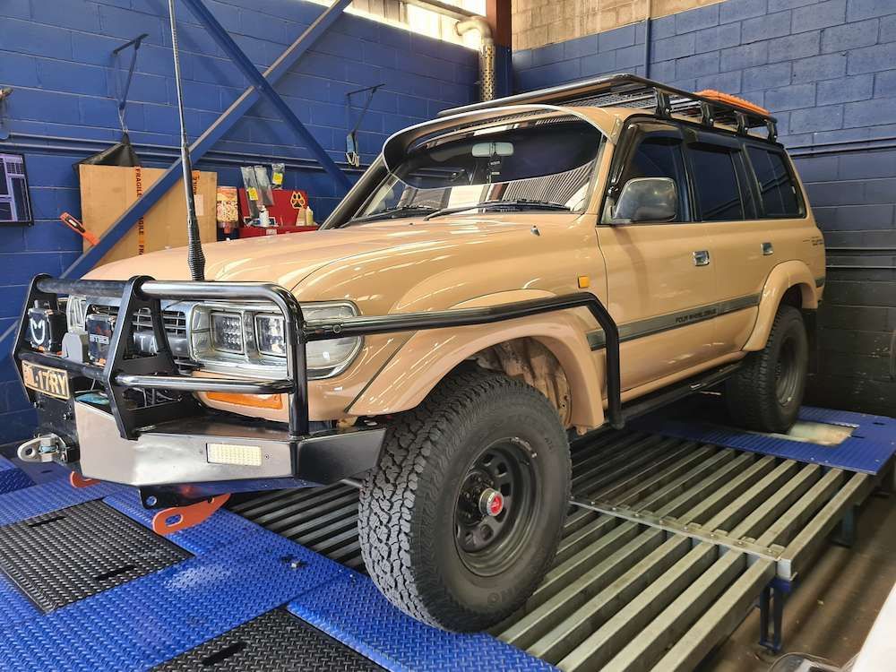 Toyota Land Cruiser on a Dyno, With Black Brush Guard — Greens Diesel Tune in Camden, NSW
