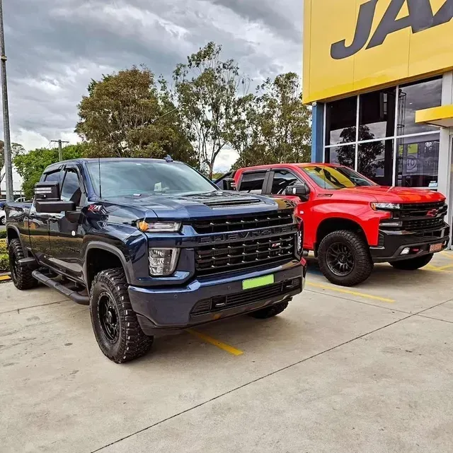 Two Chevrolet Pickup Trucks: One Blue, One Red — Greens Diesel Tune in Camden, NSW