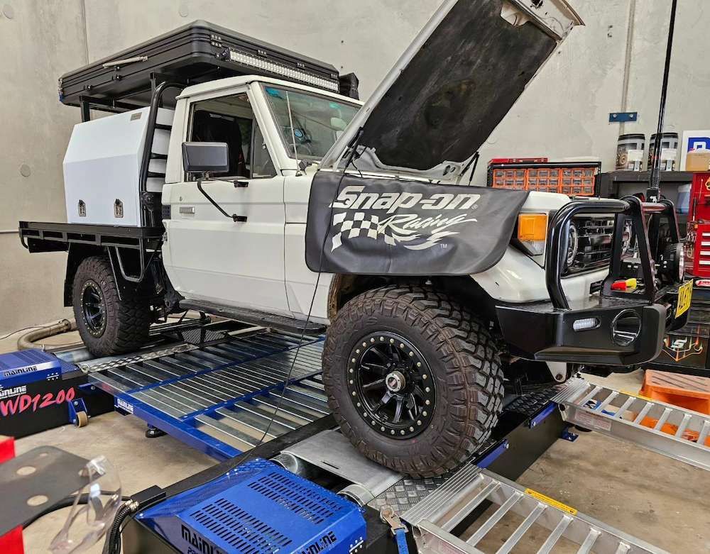 White Utility Truck on a Dynamometer With Hood Open — Greens Diesel Tune in Narellan, NSW