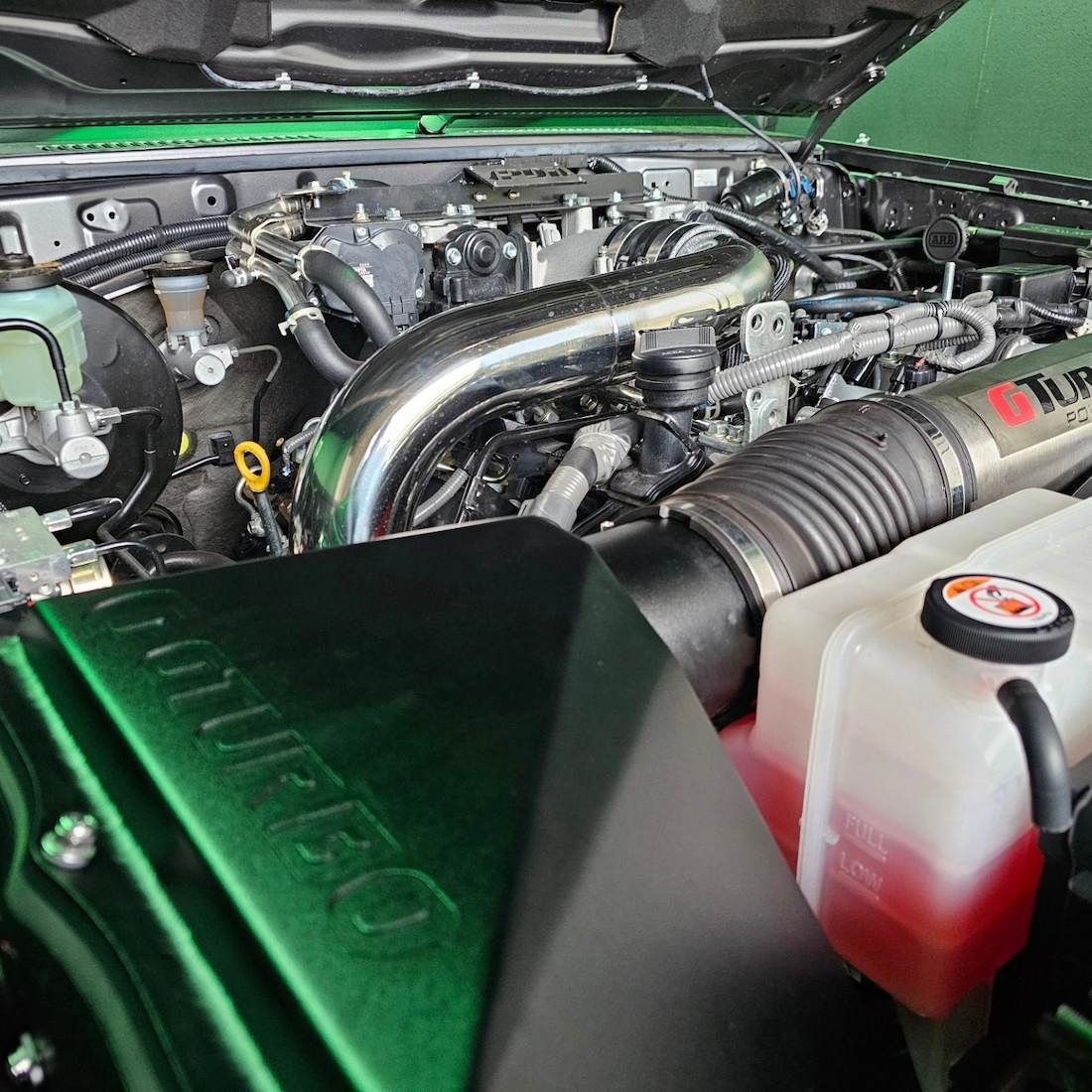 Green Engine Bay of a Modified Truck — Greens Diesel Tune in Smeaton Grange, NSW