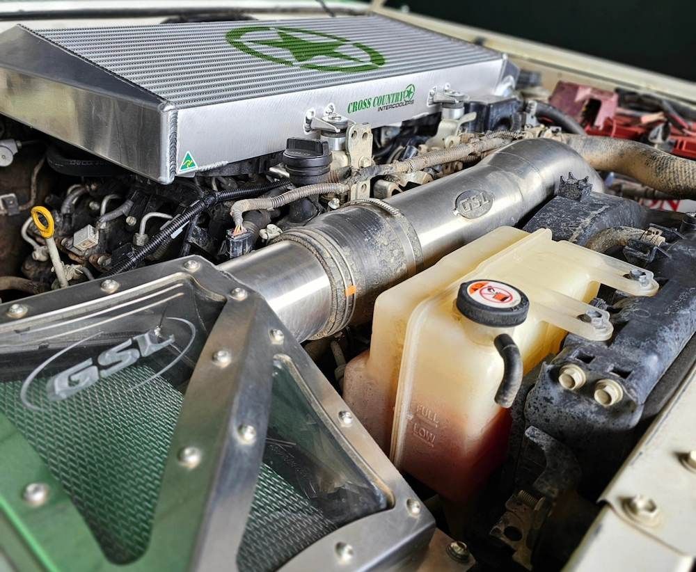 Close-up of a Vehicle Engine Bay With Custom Metal Components — Greens Diesel Tune in Smeaton Grange, NSW