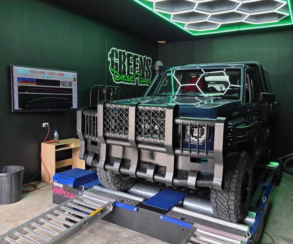 Dark Blue Suv on a Dyno Machine in a Green-themed Garage — Greens Diesel Tune in Smeaton Grange, NSW