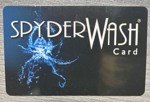 A black spyder wash card with a blue octopus on it