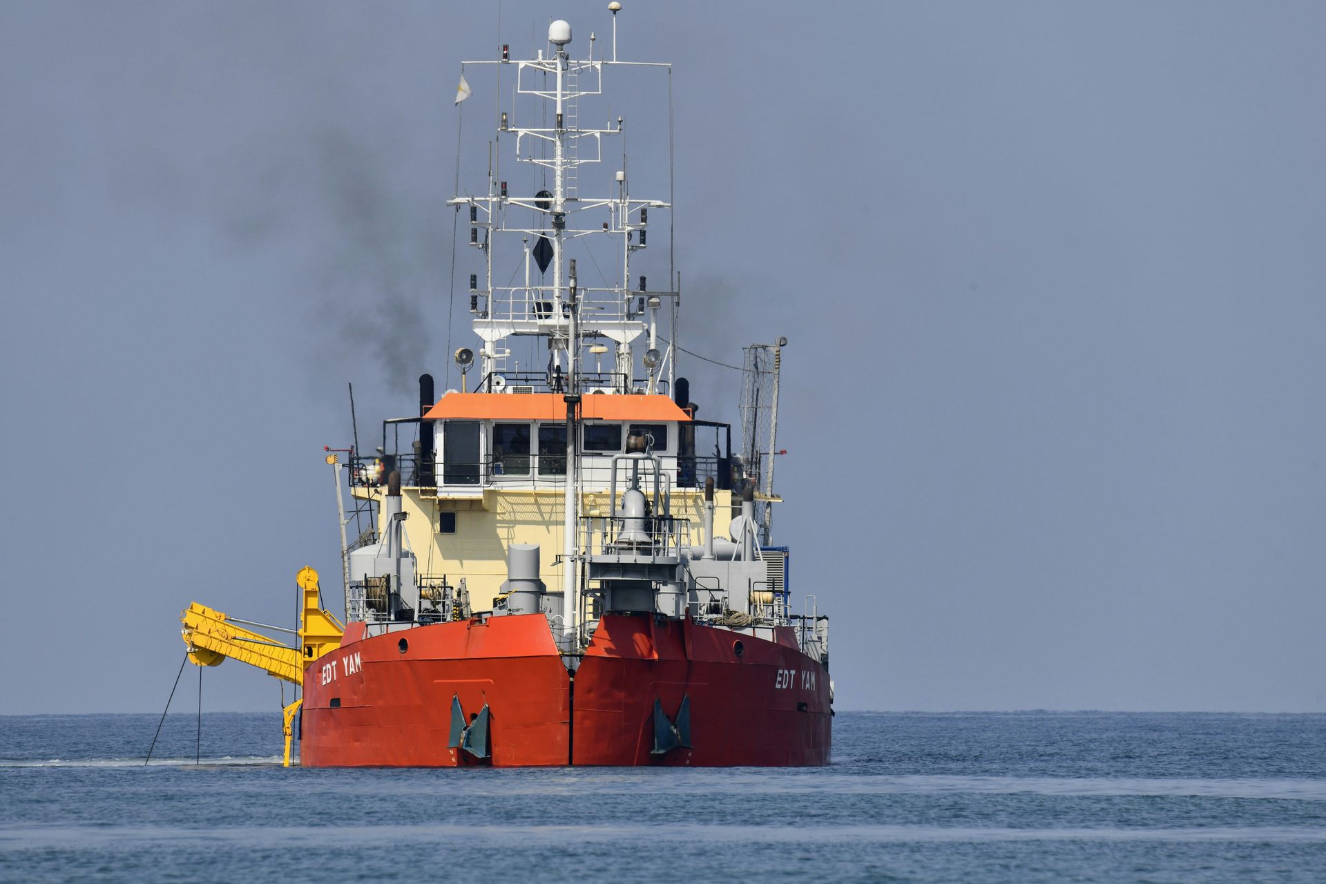 A large ship is in the middle of the ocean