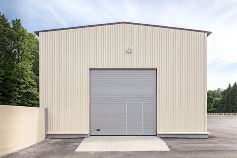 Steel Build Contractors — Industrial Storehouse with Closed Gray Metal Gate in Hereford, AZ