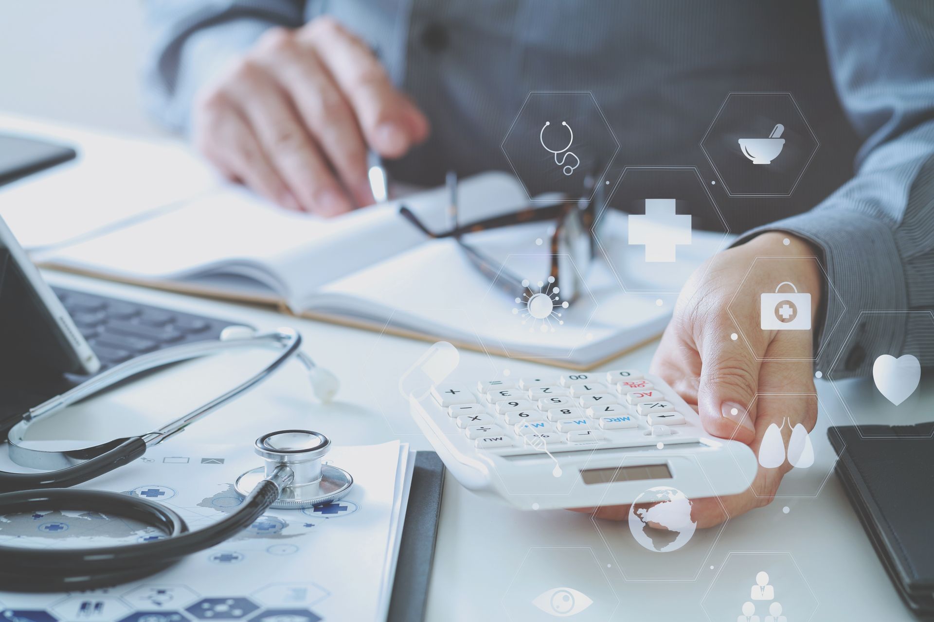 Businesspeople gather around a laptop, discussing a project in an office setting.