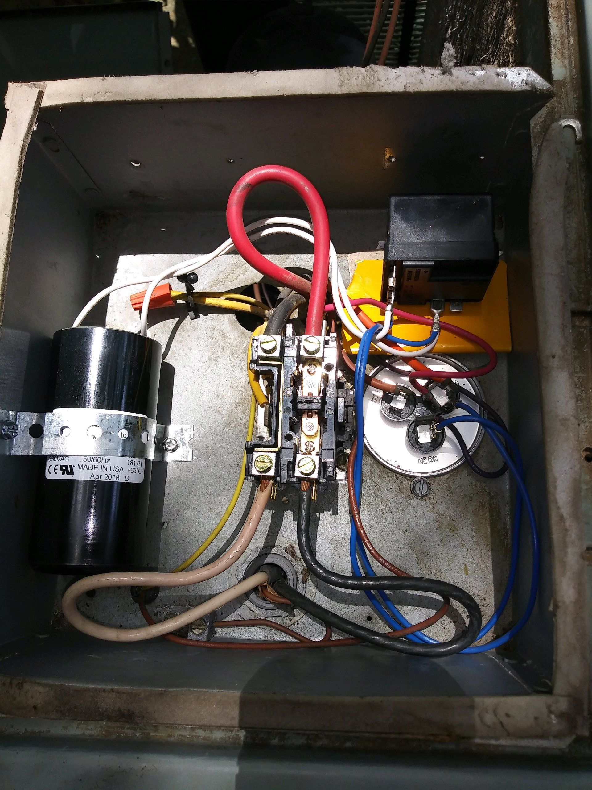 A box filled with lots of wires and electrical components.