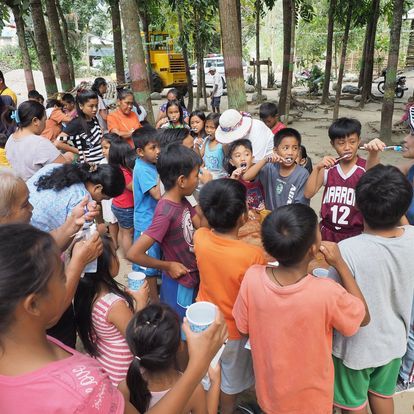 A boy wearing a jersey with the number 12 on it