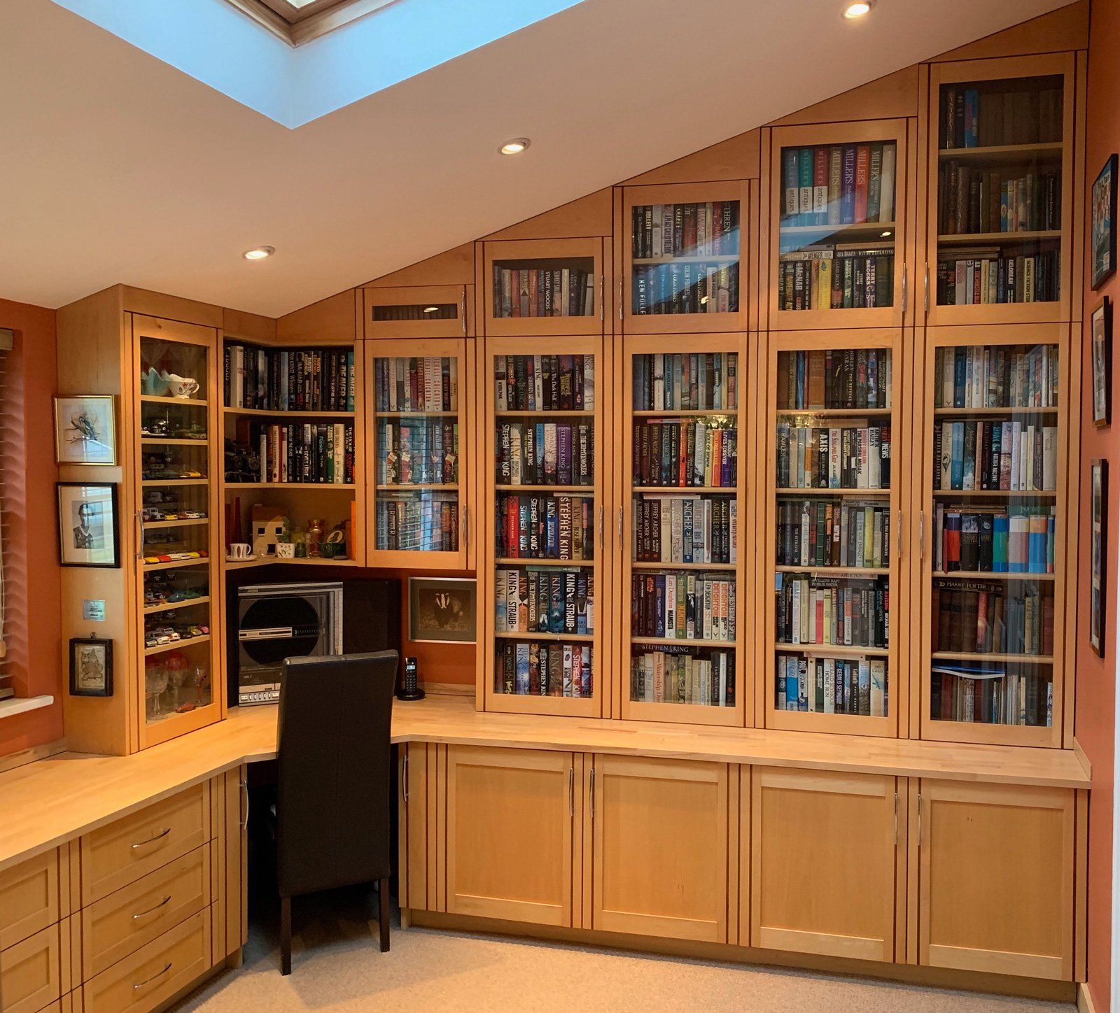 A room with a lot of books on the shelves