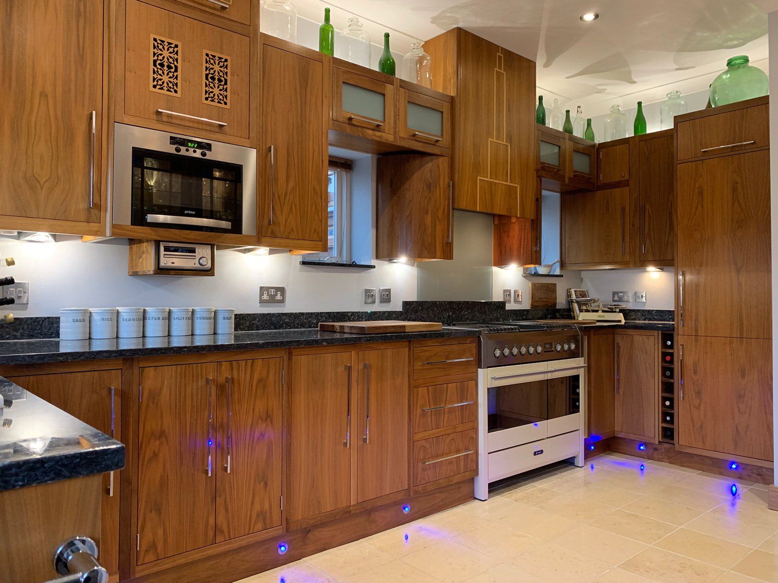 A kitchen with wooden cabinets and stainless steel appliances