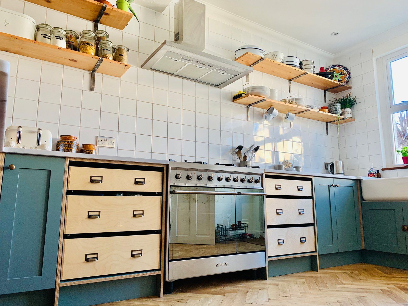 A kitchen with stainless steel appliances and wooden cabinets