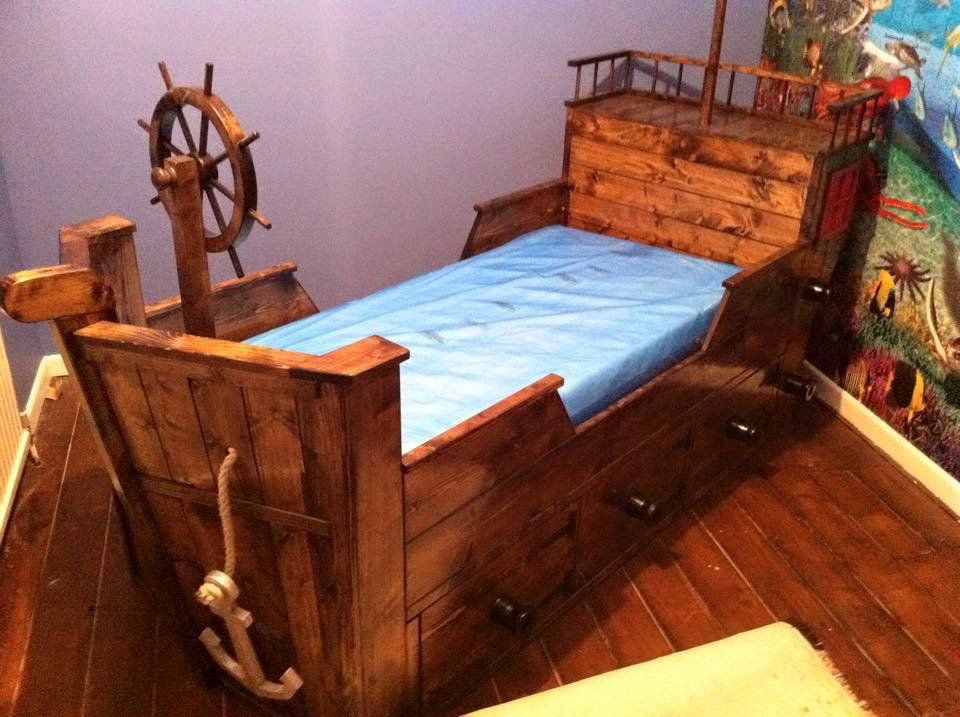 A wooden bed in the shape of a pirate ship