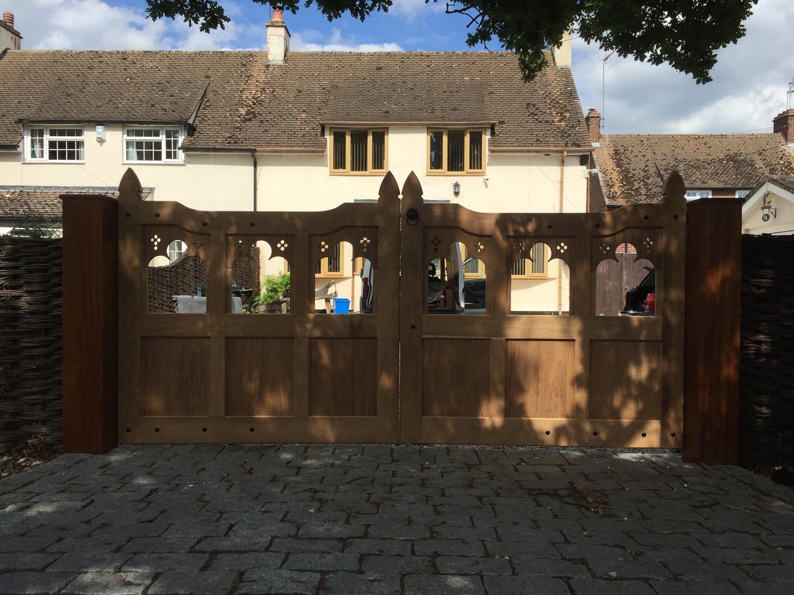 A house with a wooden gate in front of it