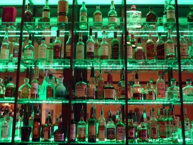 A bar filled with lots of bottles of alcohol