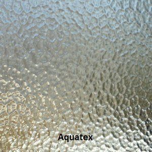 A close up of a piece of glass with the word aquatex on it.
