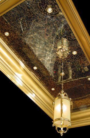 A lantern is hanging from the ceiling of a building