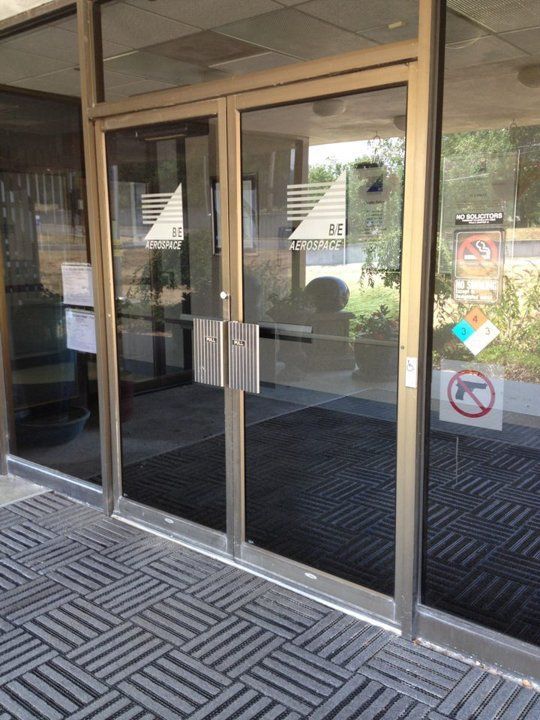 A glass door with a no dogs sign on it