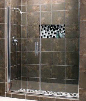 A shower with a sliding glass door and a shower head