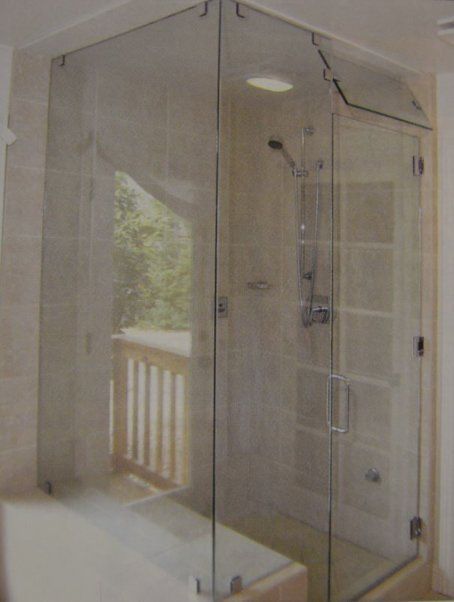 A bathroom with a walk in shower and a bathtub