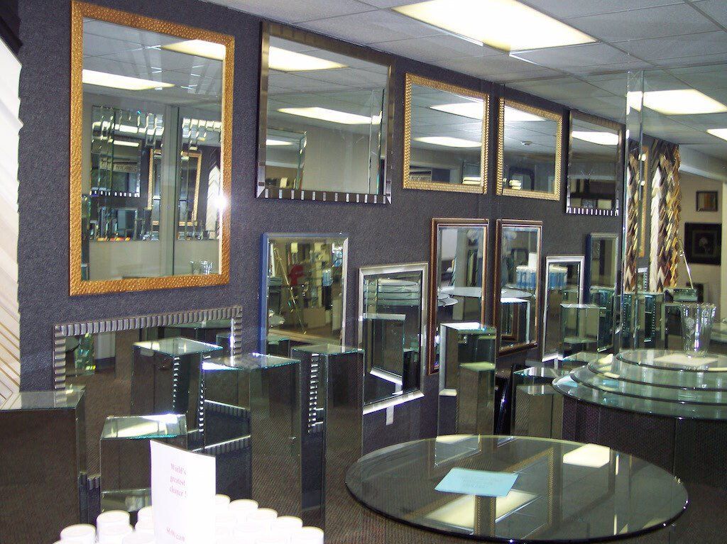 A room filled with lots of mirrors and a round table