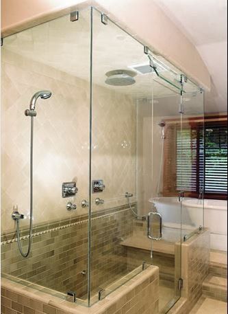 A bathroom with a walk in shower and a bathtub.