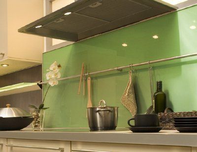 A kitchen counter with pots and pans on it