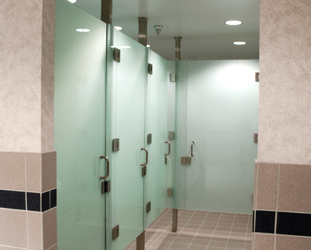 A bathroom with a row of glass doors